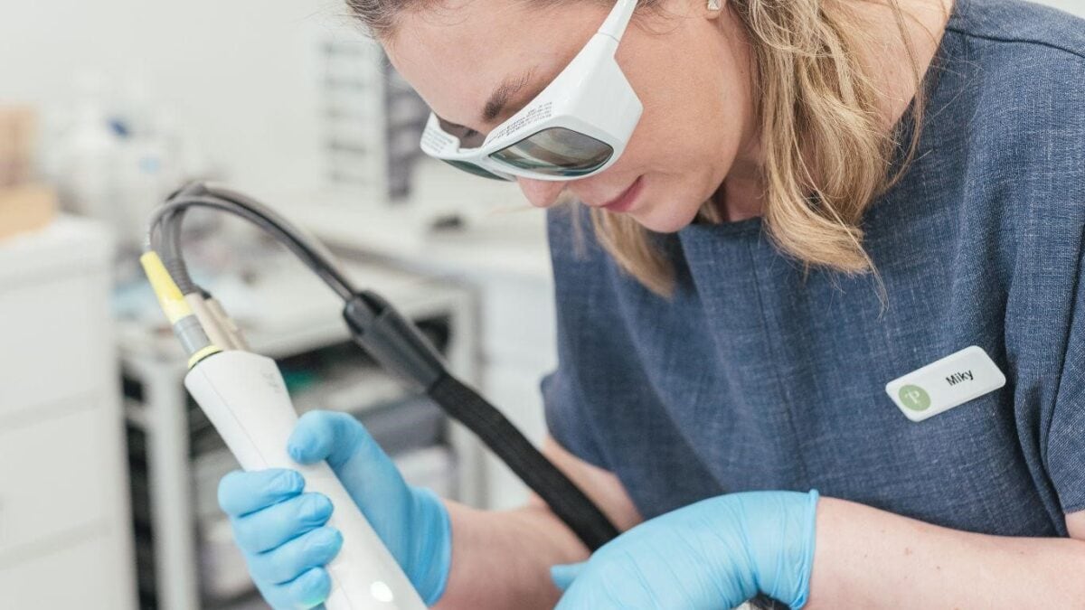 Dr Tanja Phillips applied a Fotona laser device to a patient’s cheek, targeting rosacea redness.